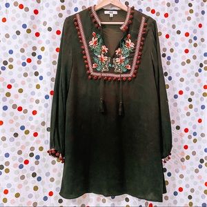 Black dress with embroidered neckline and cuffs